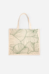 The AURA Canvas Tote in natural canvas with green palm leaf line-art print, front view