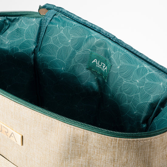 Interior of AURA Cooler Bag with green leaf-print lining and AURA Skypool logo tab
