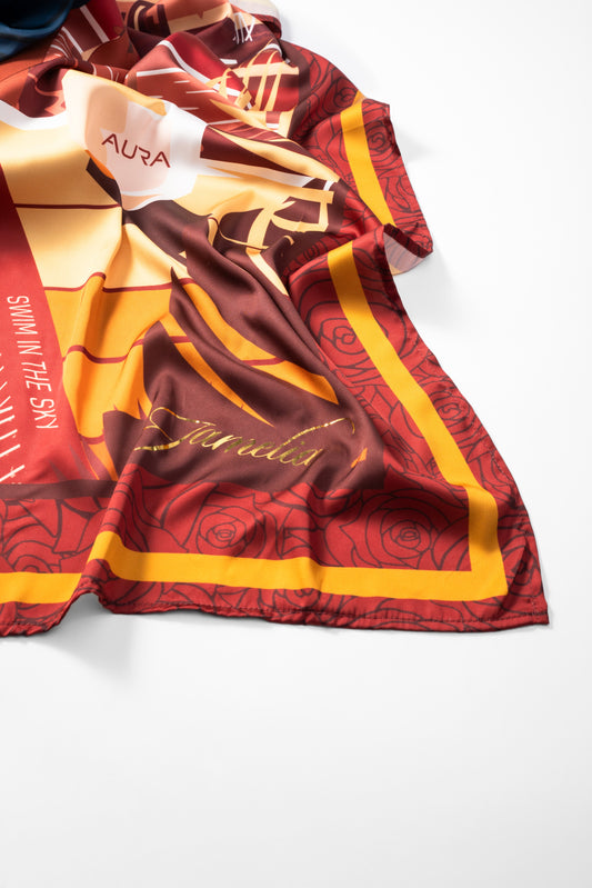 AURA Loves Jamelia Silk Scarf, draped close-up showing the Jamelia signature and rose print