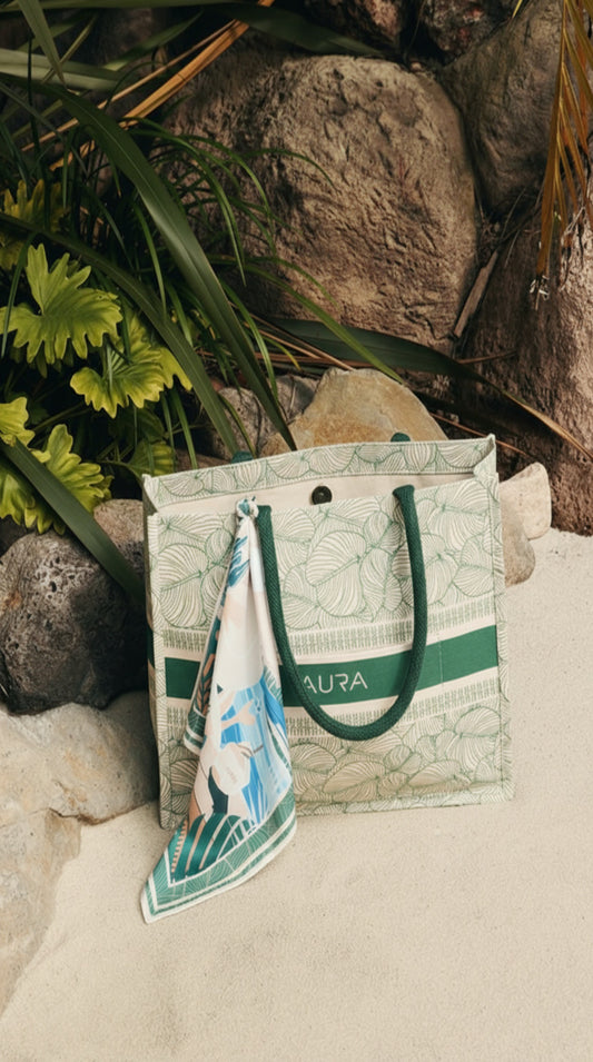 AURA Signature Tote Bag in green leaf print styled outdoors with a coordinating AURA scarf