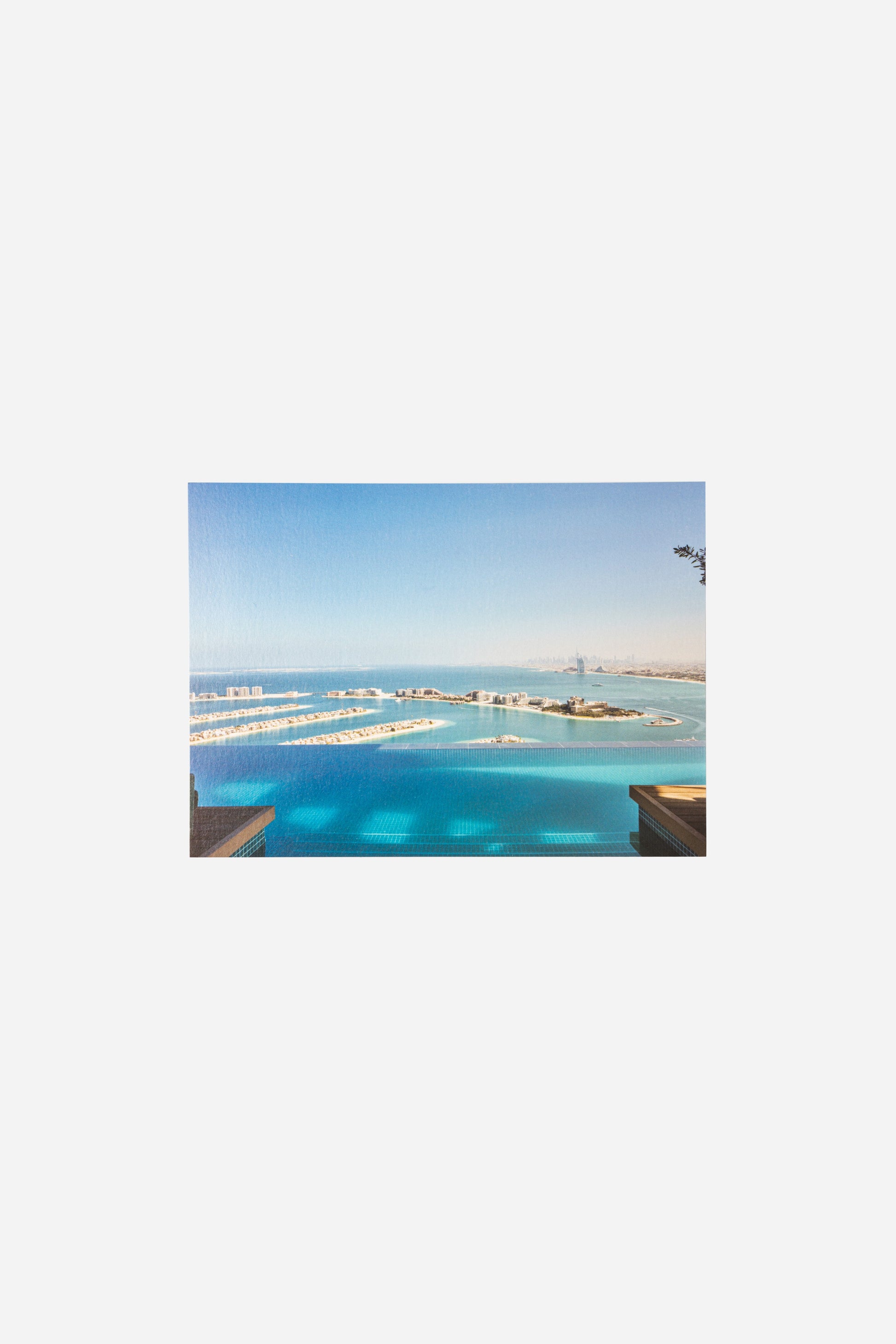 AURA Skypool postcard, aerial view of Palm Jumeirah with Burj Al Arab in the distance