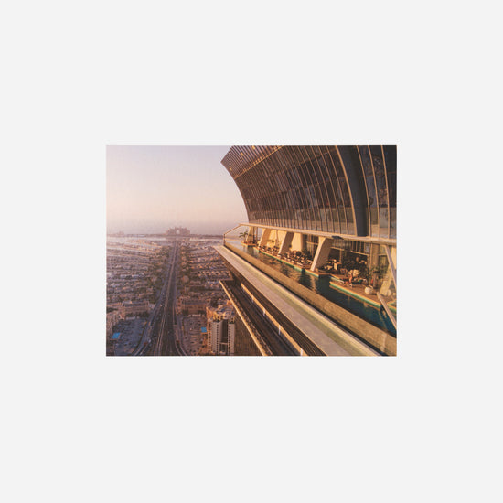 AURA Skypool postcard, wide exterior view of the skydeck structure over the city