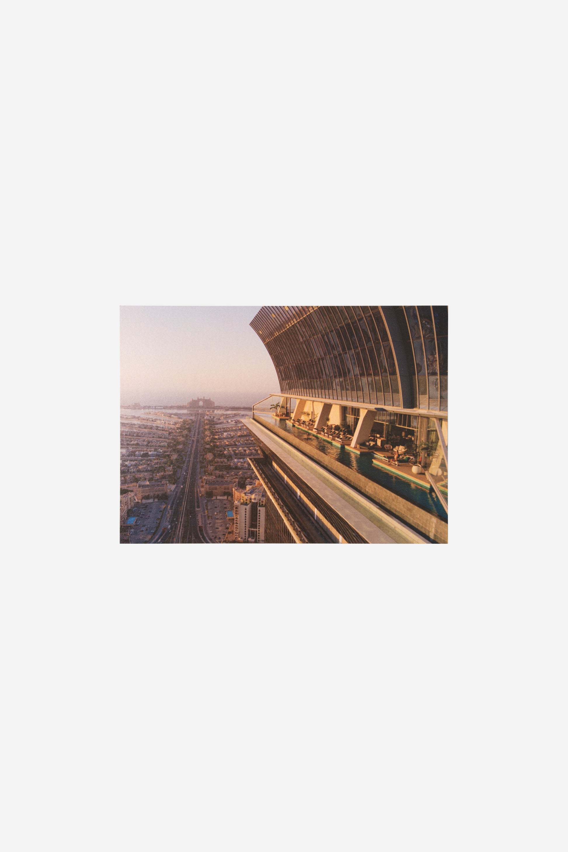 AURA Skypool postcard, wide exterior view of the skydeck structure over the city