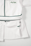 AURA woven label and green piping detail on baby bathrobe pocket