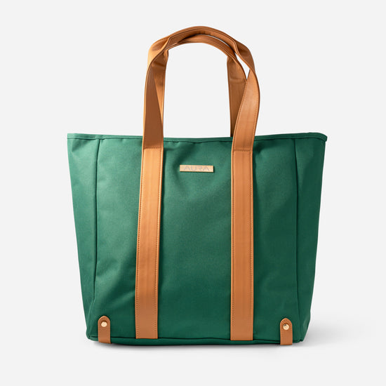 AURA Beach Bag in Palm Green with tan leather handles and gold-tone AURA plate, front view