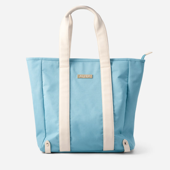 AURA Beach Bag in Whisper Blue with cream handles and gold-tone AURA plate, front view