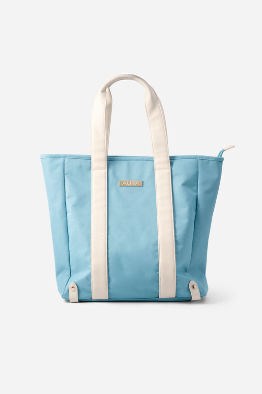 AURA Beach Bag in Whisper Blue with cream handles and gold-tone AURA plate, front view