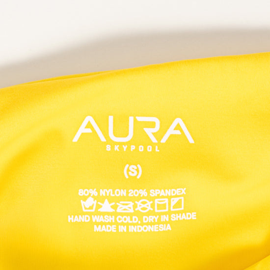 AURA Skypool care label on Calypso swimsuit, 80% nylon 20% spandex, made in Indonesia