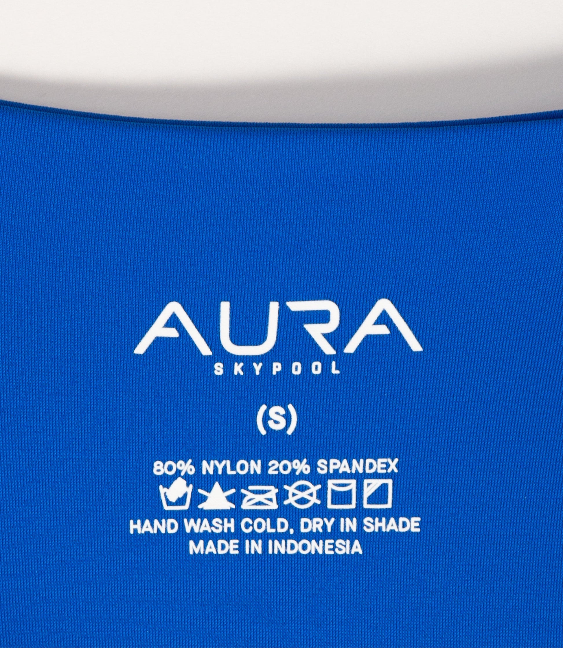 AURA Skypool care label on Calypso swimsuit, 80% nylon 20% spandex, made in Indonesia
