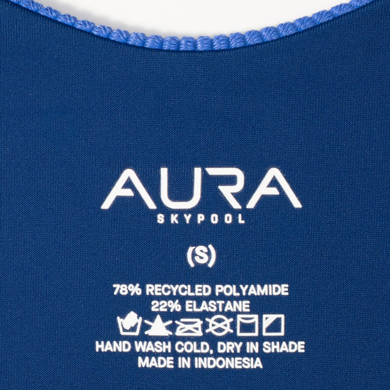 AURA care label on Cote d'AURA swimsuit, 78% recycled polyamide 22% elastane, made in Indonesia