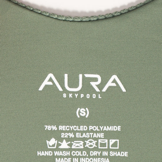 AURA care label on Cote d'AURA swimsuit, 78% recycled polyamide 22% elastane, made in Indonesia