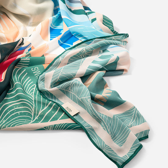 Dubai Skyline Sarong in green, draped close-up, alternate print detail