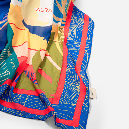 Dubai Skyline Sarong in indigo, draped close-up showing silk print and AURA label