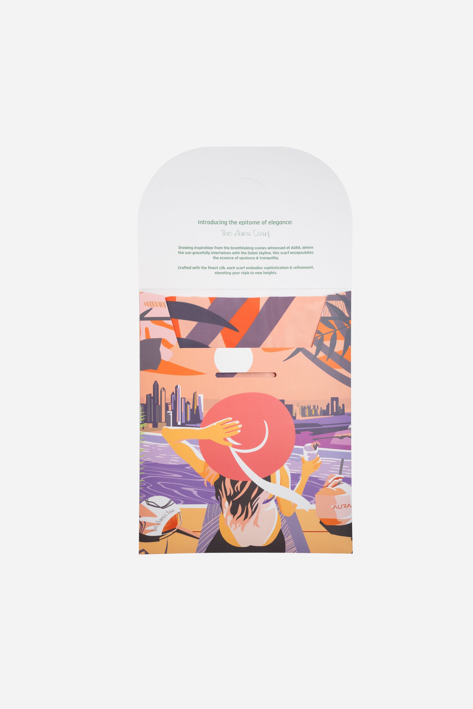 Dubai Skyline Silk Scarf in Coral, packaging card with AURA scarf description