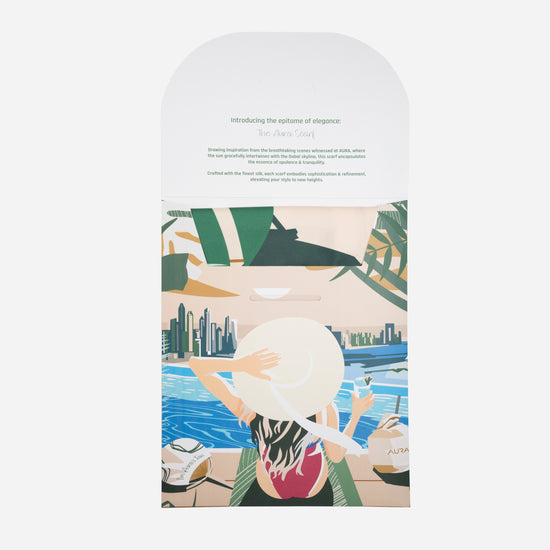 Dubai Skyline Silk Scarf in Green, packaging envelope with AURA scarf description