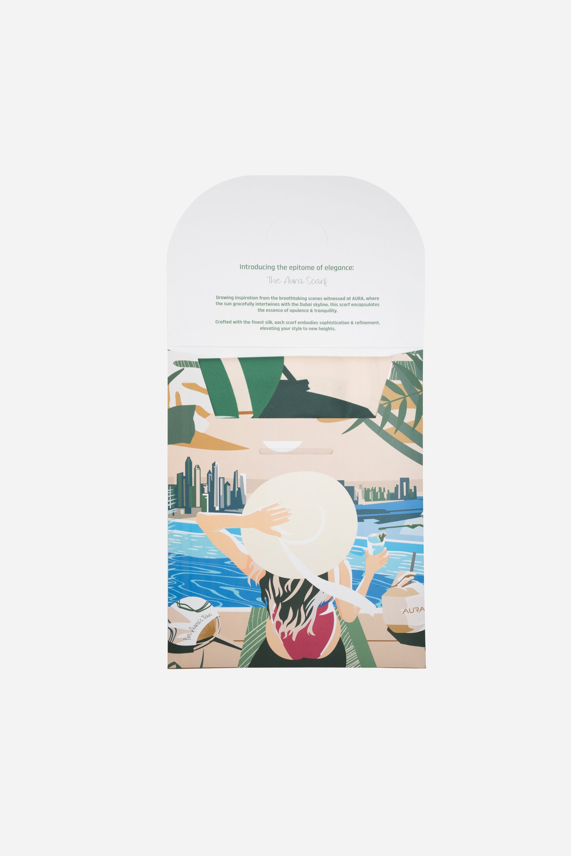 Dubai Skyline Silk Scarf in Green, packaging envelope with AURA scarf description