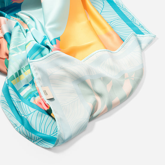 Dubai Skyline Silk Scarf in Sky Blue, bunched showing the pale reverse border print