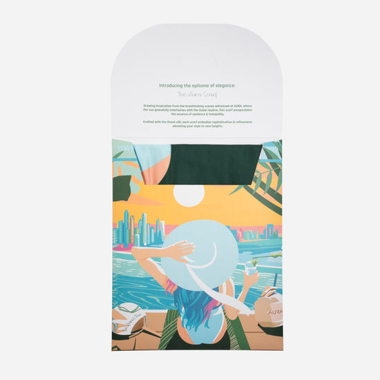 Dubai Skyline Silk Scarf in Sky Blue, packaging envelope with AURA scarf description