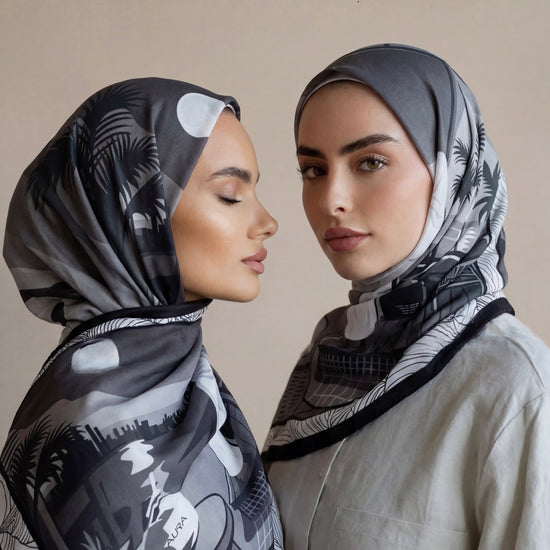 Monochrome Skyline Silk Scarf styled as hijabs on two models