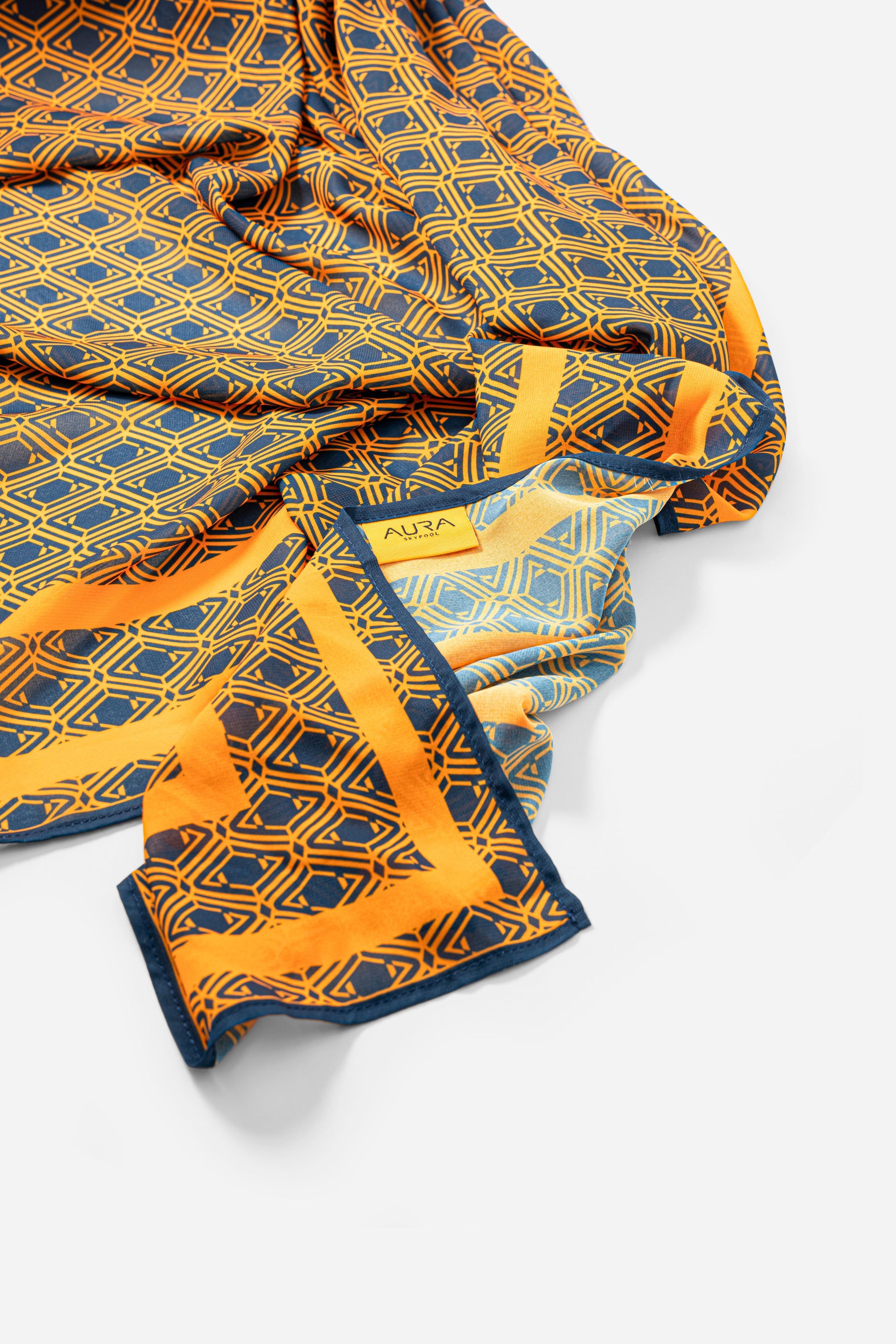 Monogram Sarong in Midnight Mirage, draped close-up with AURA label visible