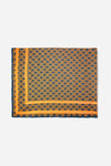 Monogram Sarong in Midnight Mirage, tube packaging front with AURA logo and geometric print
