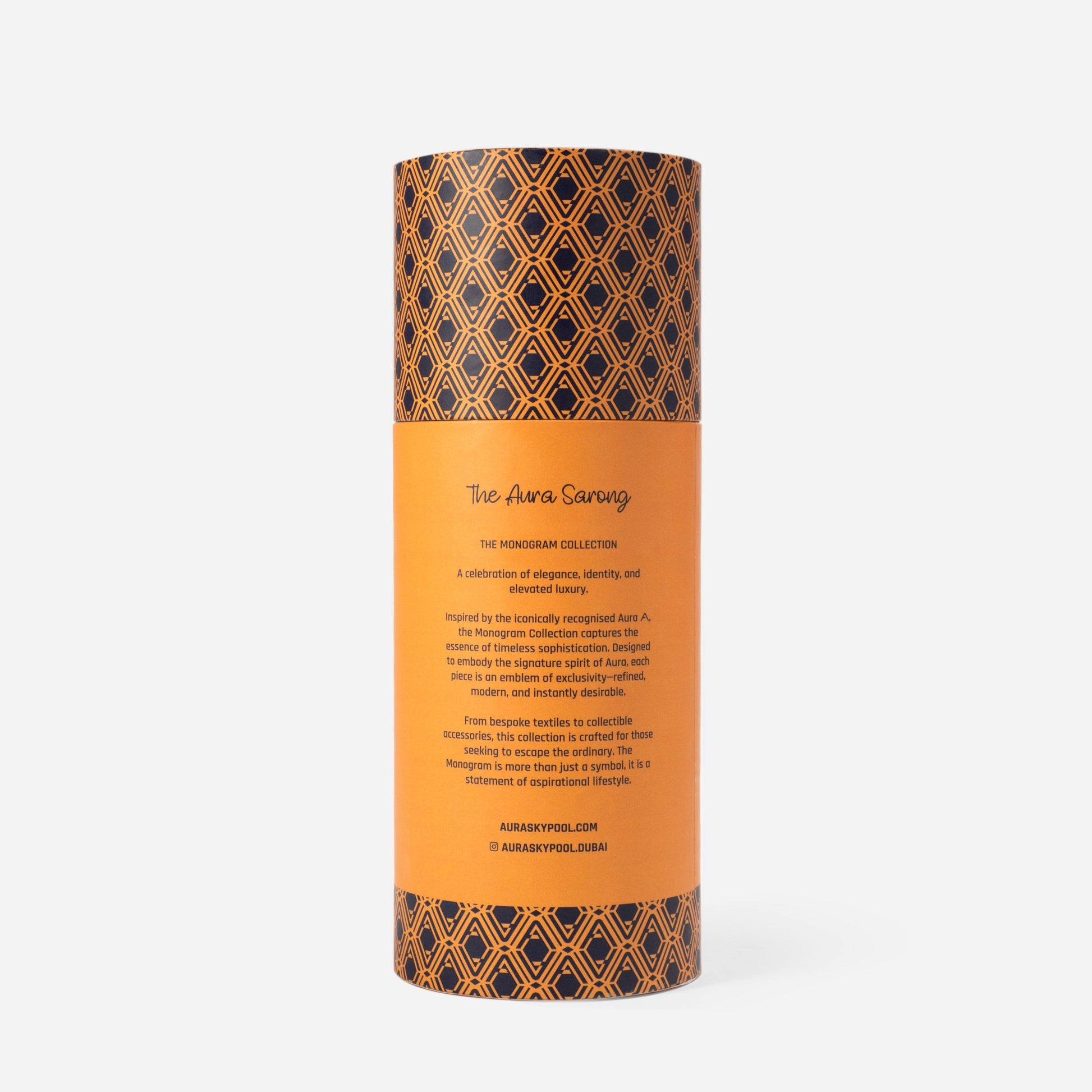Monogram Sarong in Midnight Mirage, tube packaging back reading 'The AURA Sarong, The Monogram Collection'