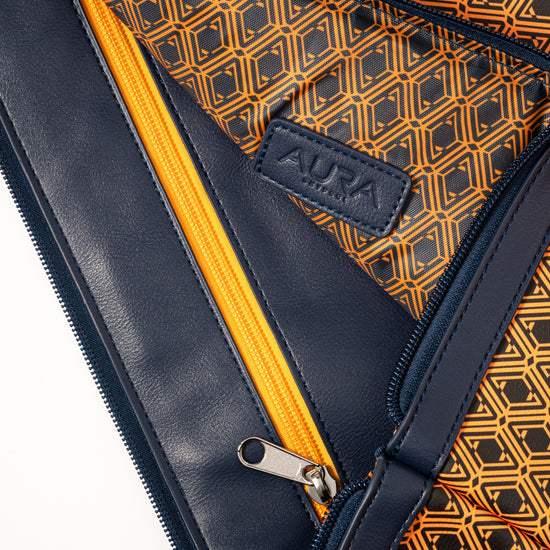 Laptop Sleeve interior open with orange zip and orange monogram-print lining