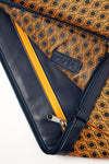 Laptop Sleeve interior open with orange zip and orange monogram-print lining