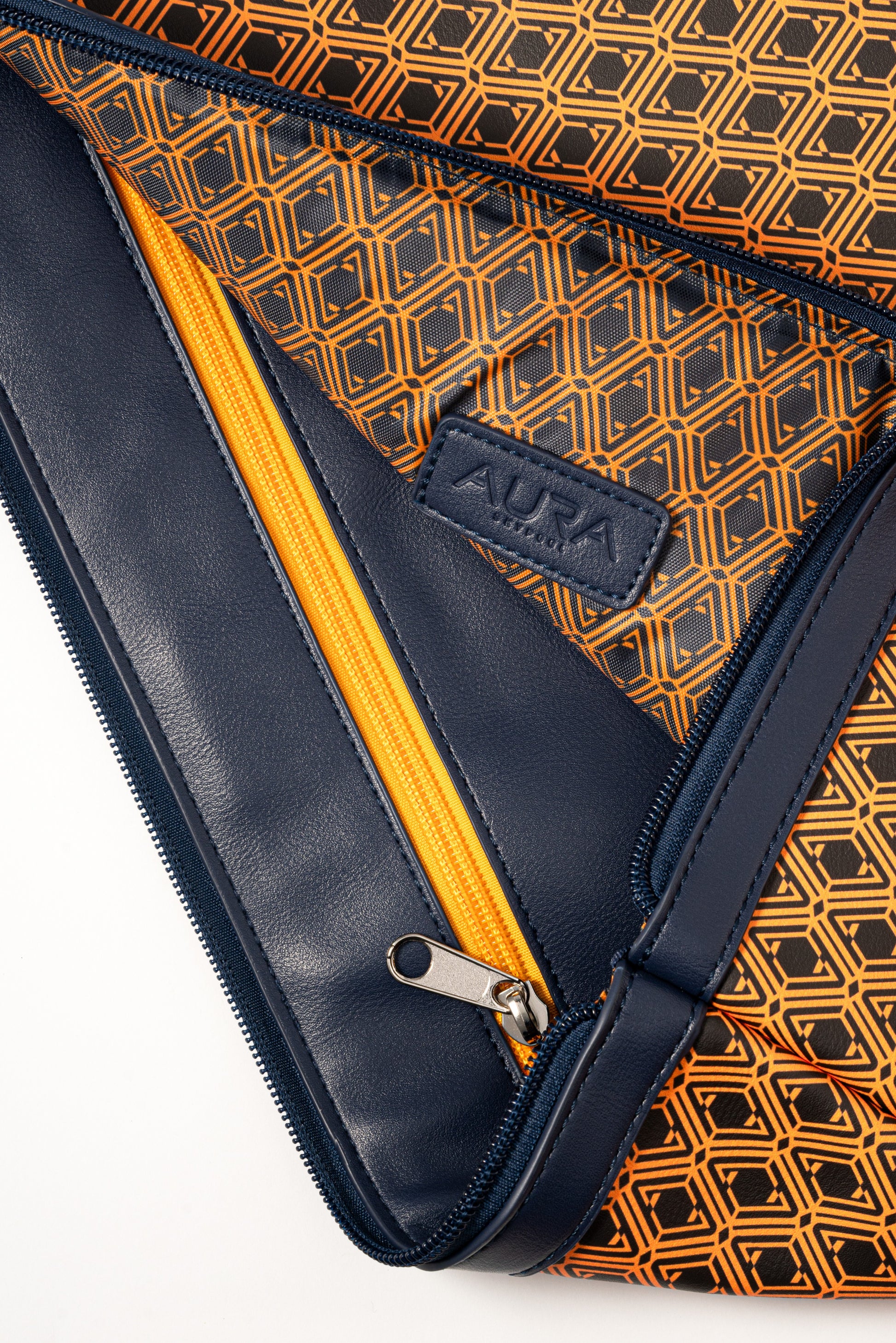 Laptop Sleeve interior open with orange zip and orange monogram-print lining