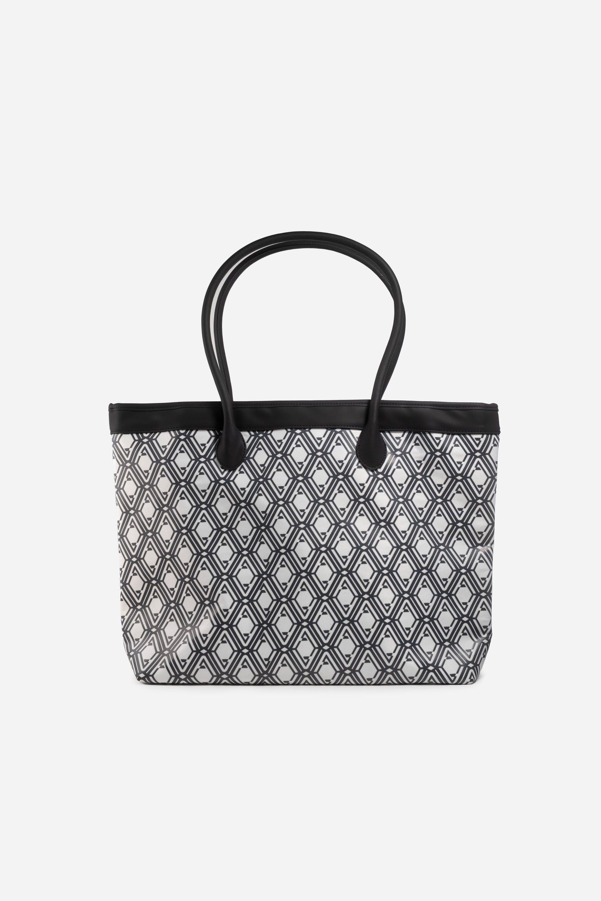 Front view of The Monogram Bag in Night Black with white and black geometric print and black handles