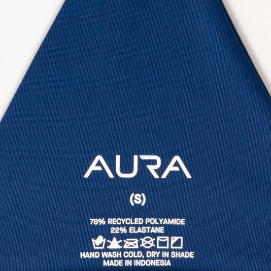 AURA Skypool care label on Nomad bikini top, 78% recycled polyamide 22% elastane, made in Indonesia