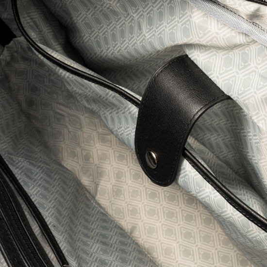 Pinnacle Laptop Case interior open showing grey monogram-print lining and strap