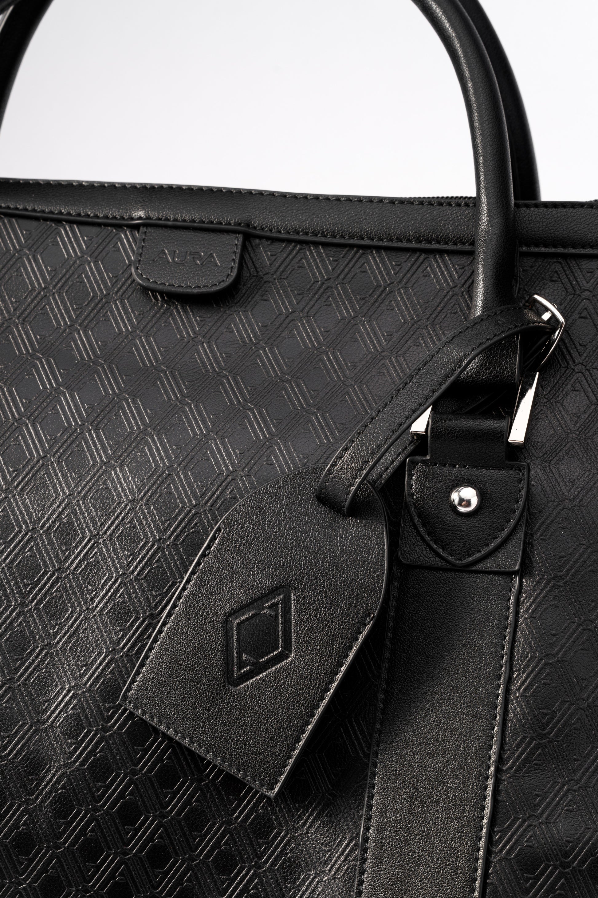 Pinnacle Duffle monogram black embossed AURA tab and matching leather luggage tag