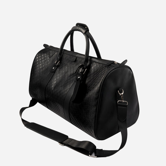 Pinnacle Duffle monogram black three-quarter view with shoulder strap