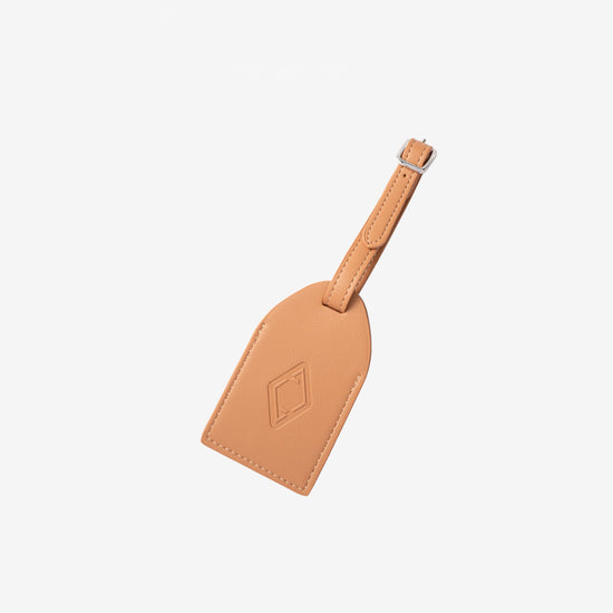 AURA Luggage Tag in Clay, leather tag with embossed logo and buckle strap