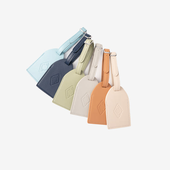 AURA Luggage Tag in Stone shown with the full six-colour range
