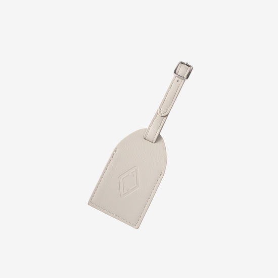 AURA Luggage Tag in Silver Grey, leather tag with embossed logo and buckle strap