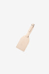 AURA Luggage Tag in Stone, leather tag with embossed logo and buckle strap