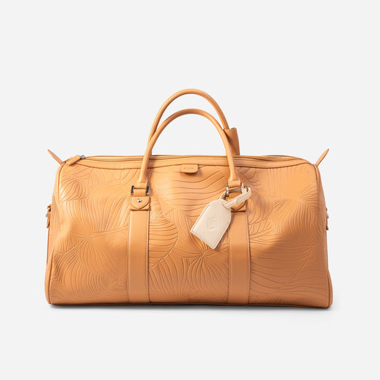Weekender Duffle clay front view showing cream leather luggage tag