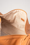 Weekender Duffle clay interior showing cream geometric-print lining