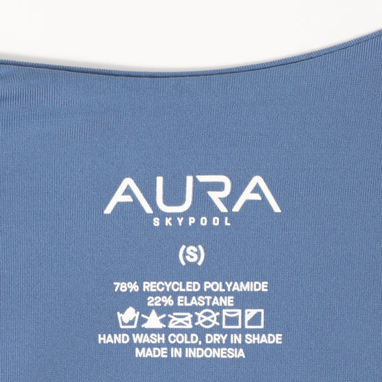 AURA care label on Sirene swimsuit, 78% recycled polyamide 22% elastane, made in Indonesia