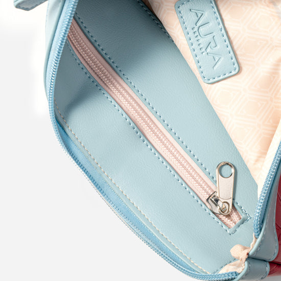 Travel Pouch in Berry, interior open with pale blue lining and blush zip