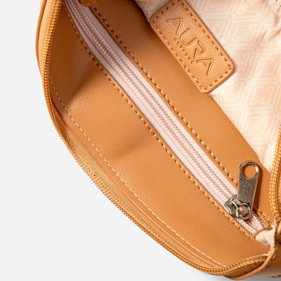Travel Pouch in Clay, interior open with blush zip and printed lining