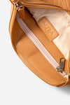 Travel Pouch in Clay, interior open with blush zip and printed lining