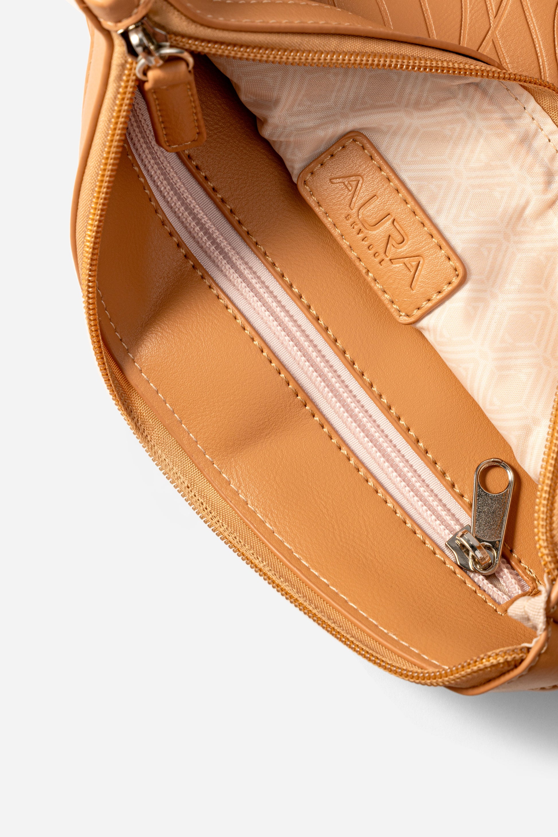 Travel Pouch in Clay, interior open with blush zip and printed lining