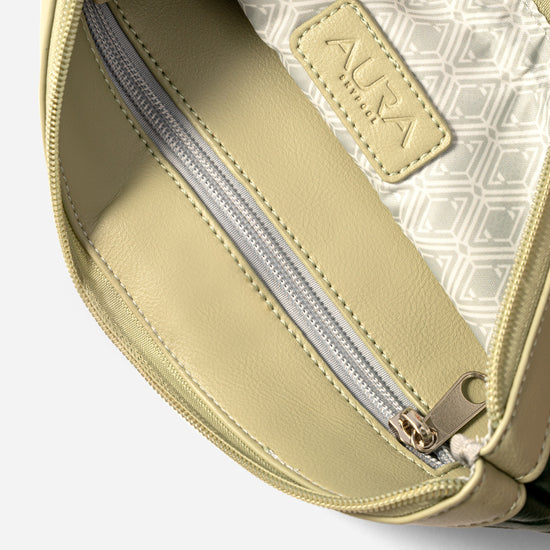 Travel Pouch in Evergreen, interior open with cream lining and silver zip