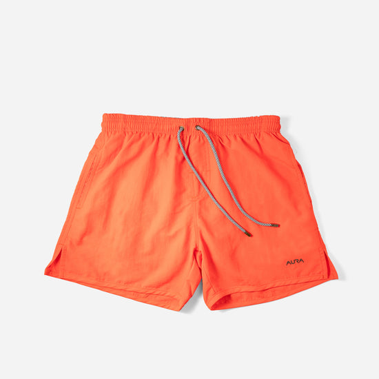 Voyager Swim Shorts in amber orange, front flat lay
