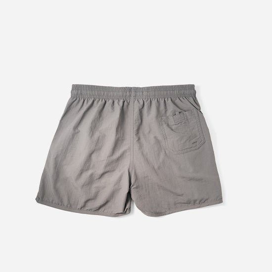 Voyager Swim Shorts in charcoal grey, back flat lay with pocket detail