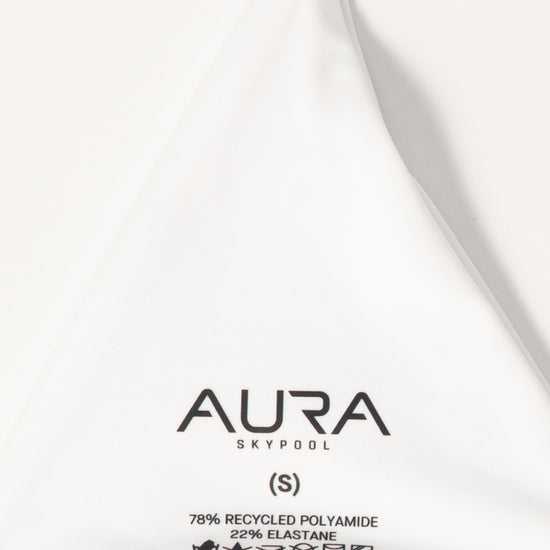 AURA Skypool care label on Wanderess bikini top, 78% recycled polyamide 22% elastane, made in Indonesia