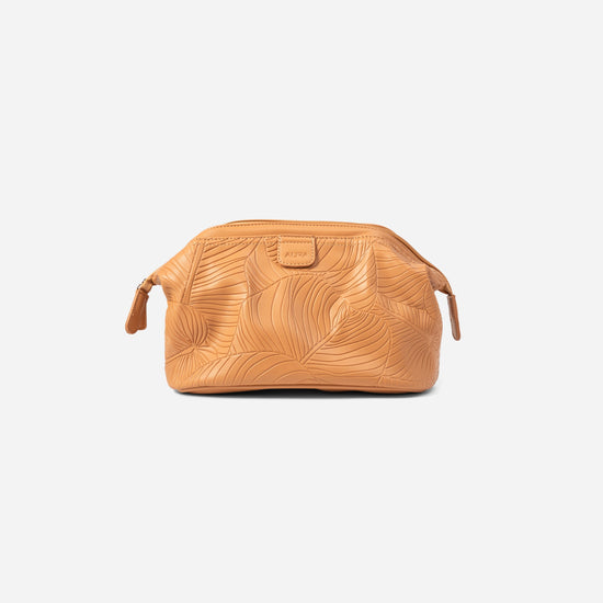 AURA wash bag in clay with leaf-embossed leather and zip pull